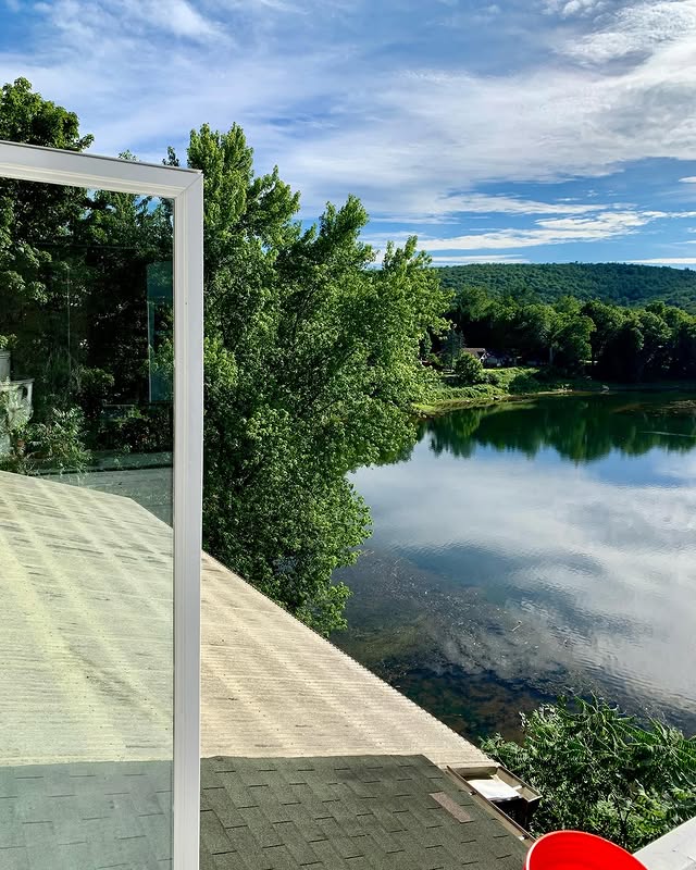 Cleaning windows with the Delaware river in view